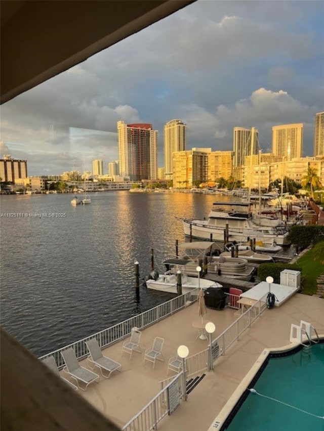 300 Golden Isles Dr Unit 311, Hallandale Beach, FL 33009 - water view with city skyline and a boat dock