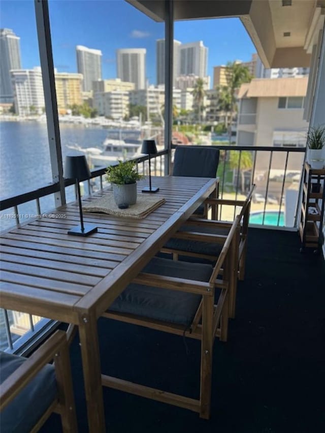 300 Golden Isles Dr Unit 311, Hallandale Beach, FL 33009 - balcony with a city view and outdoor dining space