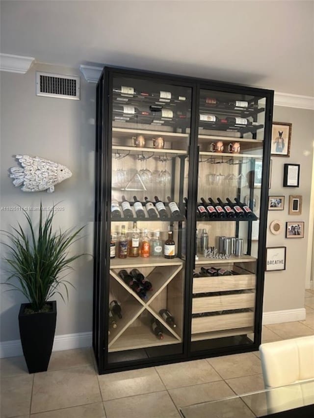 300 Golden Isles Dr Unit 311, Hallandale Beach, FL 33009 - wine area with ornamental molding and tile patterned floors