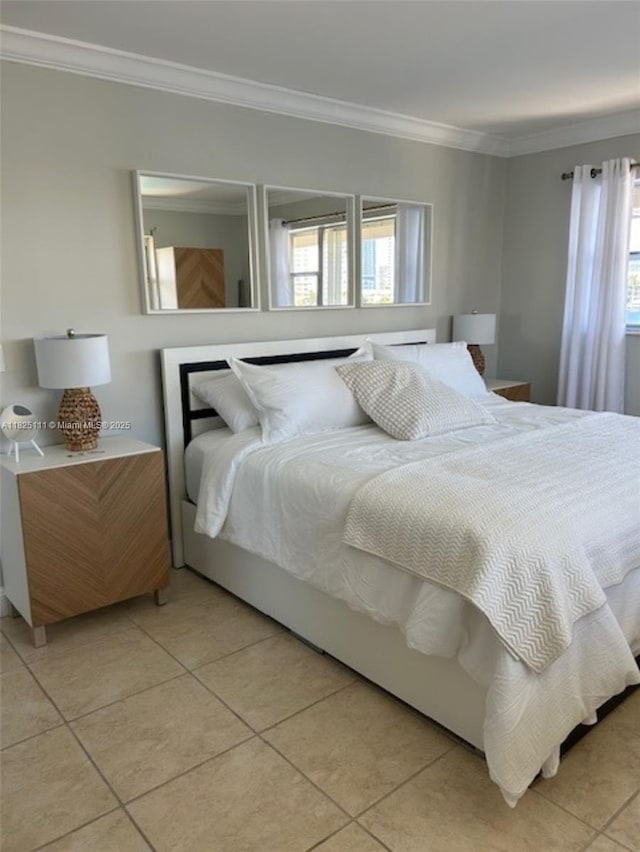 300 Golden Isles Dr Unit 311, Hallandale Beach, FL 33009 - bedroom with ornamental molding and light tile patterned flooring