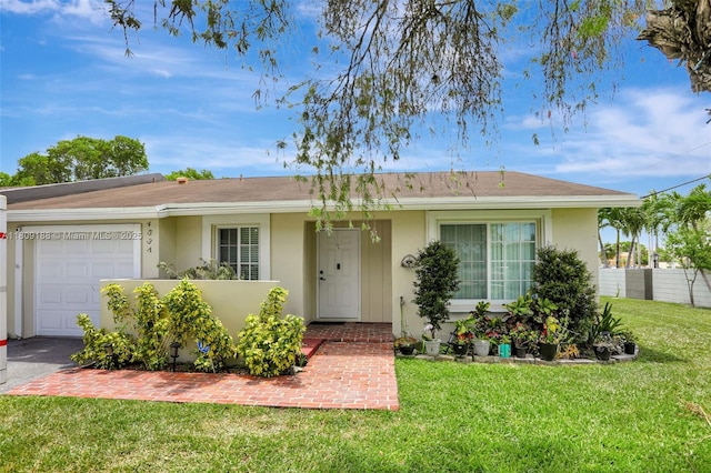 453 Lakewood Cir Unit A, Margate, FL 33063 - ranch-style house featuring stucco siding, an attached garage, and roof with shingles