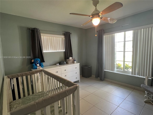 453 Lakewood Cir Unit A, Margate, FL 33063 - bedroom featuring a crib, multiple windows, and light tile patterned flooring