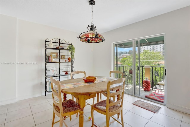 322 Madeira Ave Unit 402, Coral Gables, FL 33134 - dining space with light tile patterned floors and baseboards