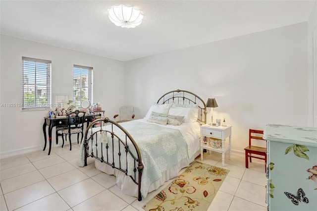 322 Madeira Ave Unit 402, Coral Gables, FL 33134 - bedroom with light tile patterned flooring and baseboards