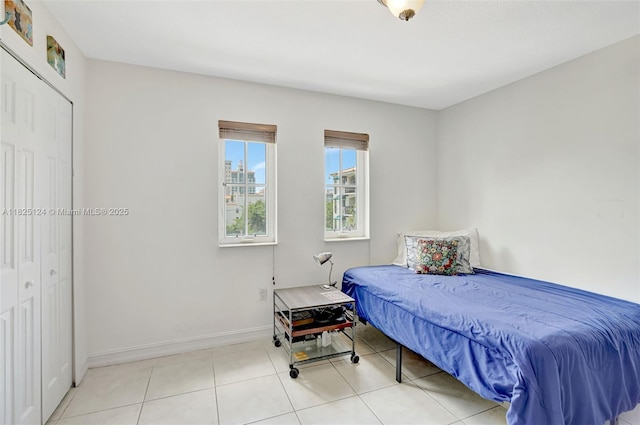 322 Madeira Ave Unit 402, Coral Gables, FL 33134 - tiled bedroom featuring baseboards