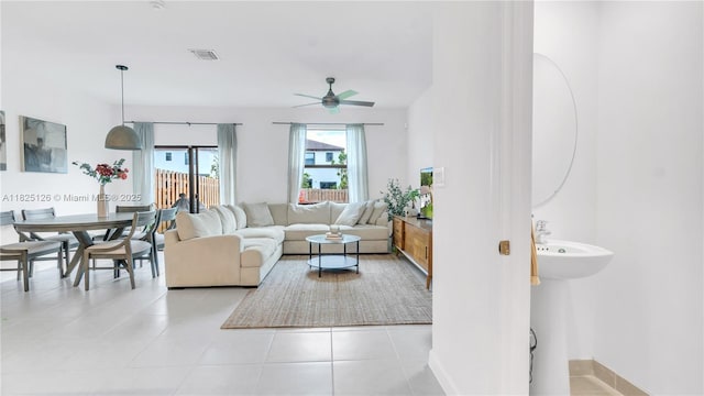 25564 SW 108th Ave, Homestead, FL 33032 - living area featuring ceiling fan and light tile patterned flooring