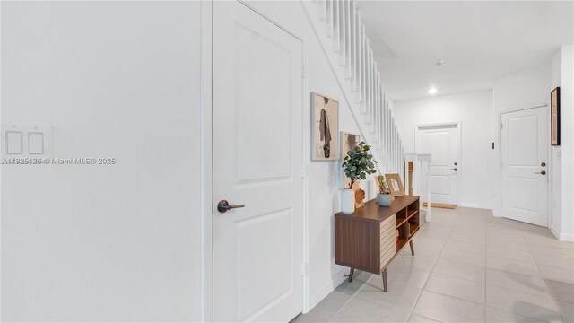 25564 SW 108th Ave, Homestead, FL 33032 - hall featuring light tile patterned flooring and stairway