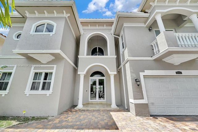 3521 Forest View Cir, Dania Beach, FL 33312 - property entrance featuring french doors, stucco siding, and an attached garage