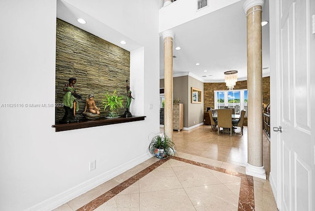 3521 Forest View Cir, Dania Beach, FL 33312 - hallway featuring decorative columns, ornamental molding, recessed lighting, inlaid floor details, and a chandelier