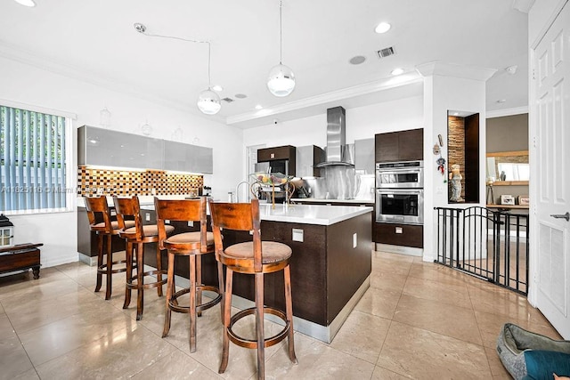3521 Forest View Cir, Dania Beach, FL 33312 - kitchen with extractor fan, stainless steel double oven, crown molding, decorative backsplash, and light countertops