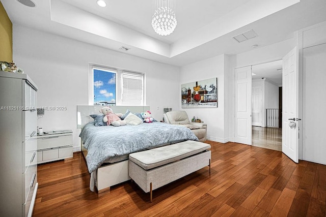 3521 Forest View Cir, Dania Beach, FL 33312 - bedroom with wood finished floors, a raised ceiling, recessed lighting, and a chandelier