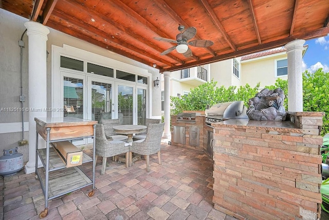3521 Forest View Cir, Dania Beach, FL 33312 - view of patio featuring exterior kitchen, a ceiling fan, and outdoor dining area
