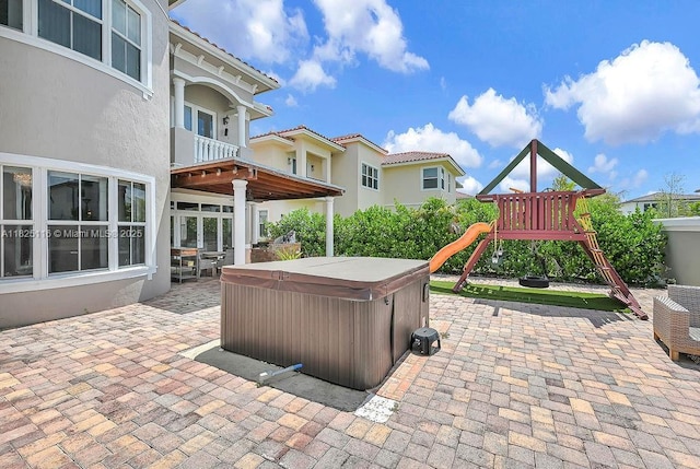 3521 Forest View Cir, Dania Beach, FL 33312 - view of patio / terrace featuring a hot tub and a playground