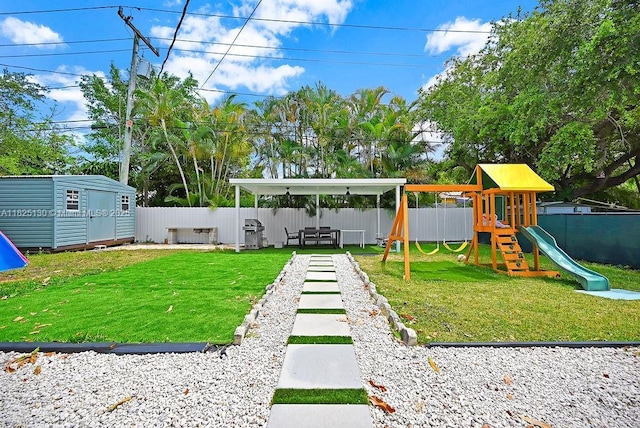 876 NE 81st St, Miami, FL 33138 - fenced backyard with a playground and a storage unit