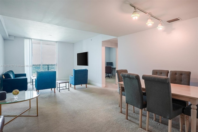 1250 S Miami Ave Unit 3003, Miami, FL 33130 - carpeted dining area featuring rail lighting and baseboards