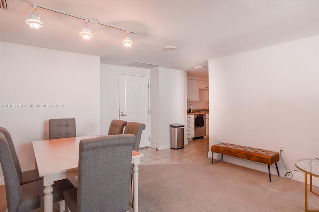 1250 S Miami Ave Unit 3003, Miami, FL 33130 - dining area with rail lighting, light carpet, and light tile patterned floors