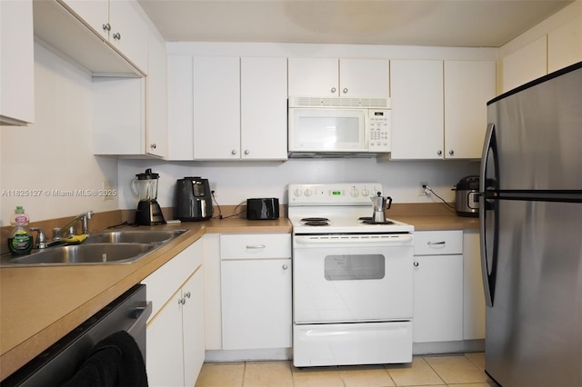 1250 S Miami Ave Unit 3003, Miami, FL 33130 - kitchen with white appliances, white cabinets, and light tile patterned flooring