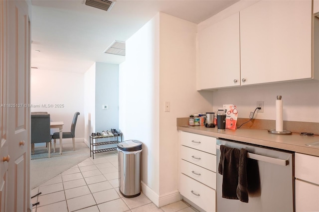 1250 S Miami Ave Unit 3003, Miami, FL 33130 - kitchen featuring stainless steel dishwasher, light countertops, white cabinets, and light tile patterned floors