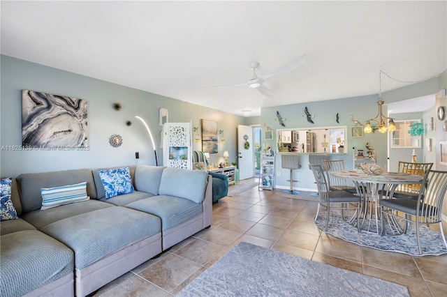 5725 Pelican Pointe, Sebastian, FL 32958 - tiled living room featuring a chandelier and ceiling fan