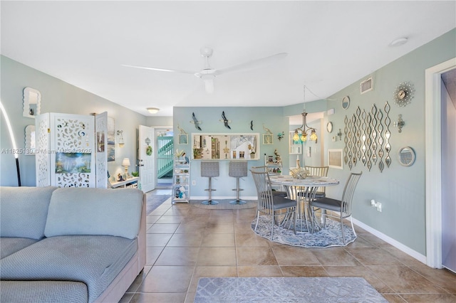 5725 Pelican Pointe, Sebastian, FL 32958 - tiled living room featuring a ceiling fan and baseboards