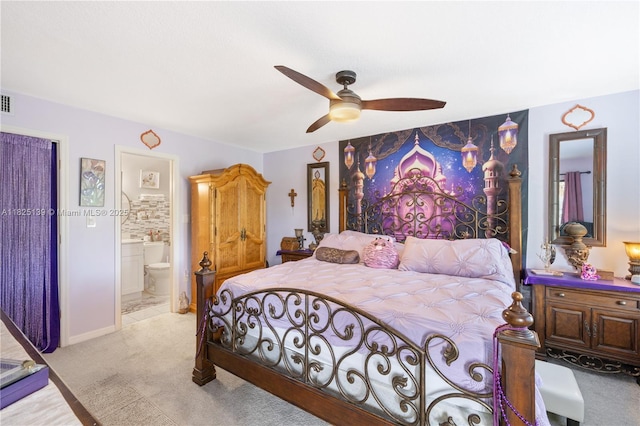 5725 Pelican Pointe, Sebastian, FL 32958 - bedroom with light carpet, ensuite bathroom, and a ceiling fan