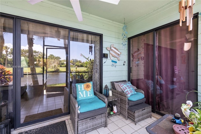 5725 Pelican Pointe, Sebastian, FL 32958 - sunroom / solarium featuring a water view