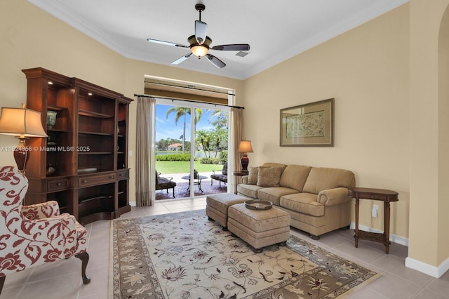 819 SW Bromelia Ter, Stuart, FL 34997 - living area featuring light tile patterned flooring, ceiling fan, and crown molding