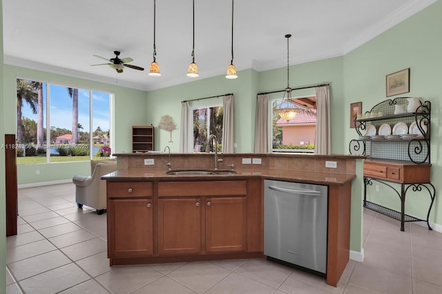 819 SW Bromelia Ter, Stuart, FL 34997 - kitchen featuring dishwasher, healthy amount of natural light, dark stone counters, a ceiling fan, and ornamental molding