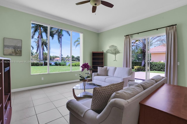 819 SW Bromelia Ter, Stuart, FL 34997 - living room featuring ceiling fan, ornamental molding, and light tile patterned flooring