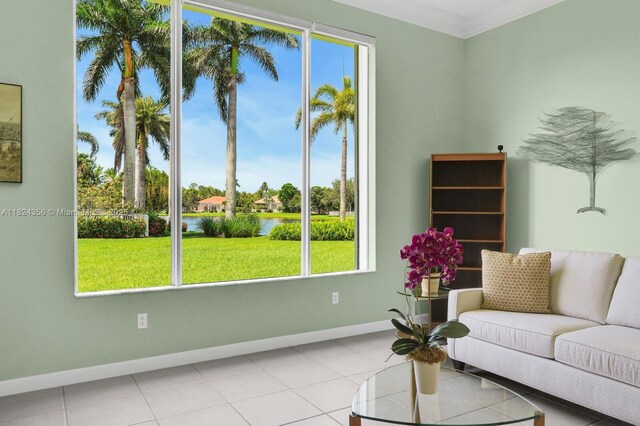 819 SW Bromelia Ter, Stuart, FL 34997 - tiled living area featuring a water view and baseboards