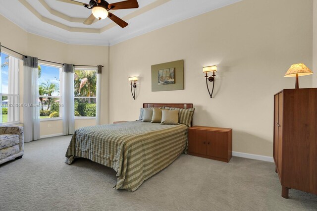 819 SW Bromelia Ter, Stuart, FL 34997 - carpeted bedroom featuring crown molding and a raised ceiling