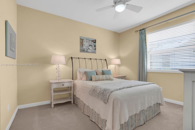 819 SW Bromelia Ter, Stuart, FL 34997 - bedroom with light colored carpet and a ceiling fan