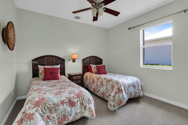 819 SW Bromelia Ter, Stuart, FL 34997 - carpeted bedroom with baseboards and ceiling fan
