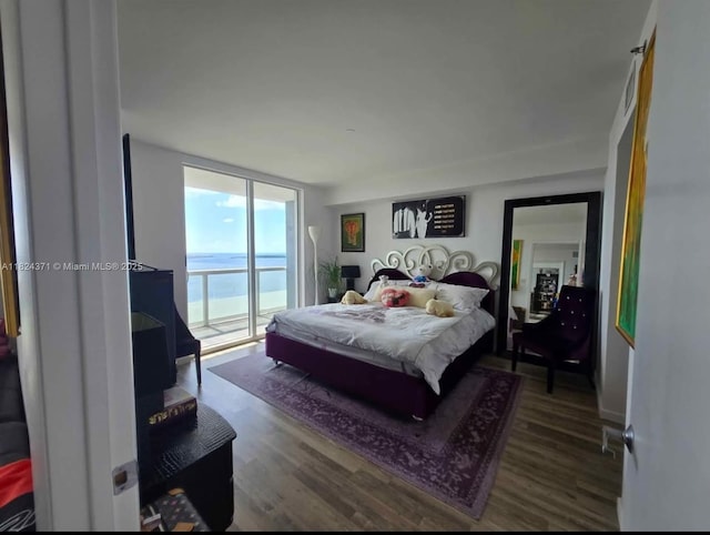 50 Biscayne Blvd Unit 3006, Miami, FL 33132 - bedroom with wood finished floors, access to exterior, and expansive windows