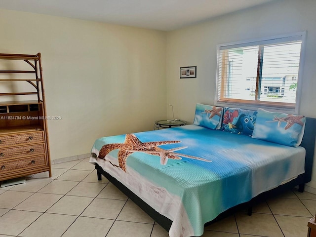 930 SE 9th Ave Unit 11, Pompano Beach, FL 33060 - bedroom featuring light tile patterned flooring