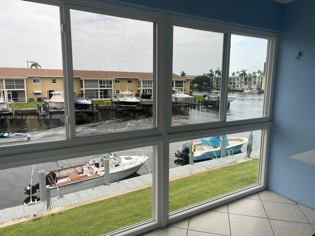 930 SE 9th Ave Unit 11, Pompano Beach, FL 33060 - doorway to outside featuring a water view and tile patterned flooring