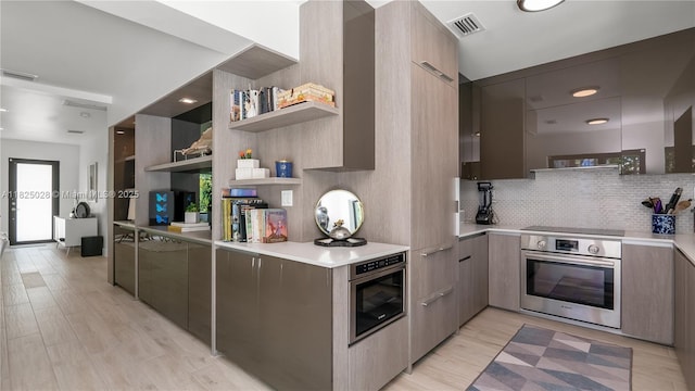 3020 SW 2nd Ave, Miami, FL 33129 - kitchen featuring stainless steel oven, modern cabinets, open shelves, light countertops, and tasteful backsplash