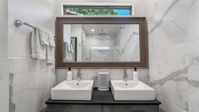 3020 SW 2nd Ave, Miami, FL 33129 - full bathroom featuring tile walls, double vanity, a marble finish shower, and tasteful backsplash