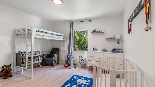 3020 SW 2nd Ave, Miami, FL 33129 - bedroom with wood finished floors and a nursery area