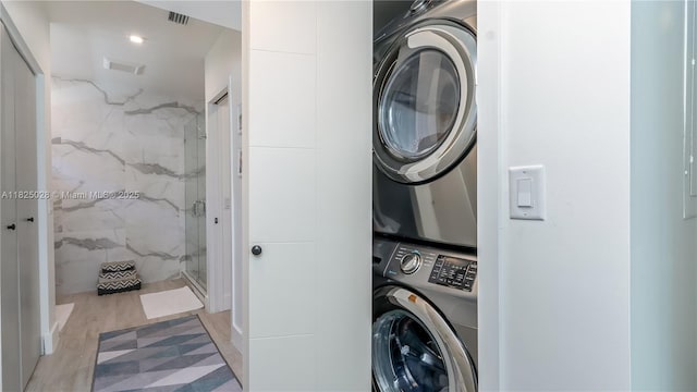 3020 SW 2nd Ave, Miami, FL 33129 - washroom featuring stacked washing machine and dryer and tile walls
