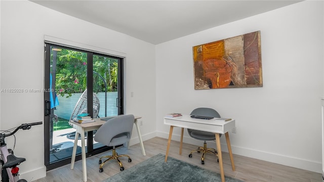 3020 SW 2nd Ave, Miami, FL 33129 - home office featuring baseboards and light wood finished floors