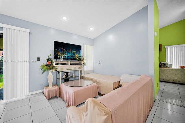 5610 NW 54th Ave, Tamarac, FL 33319 - tiled living area with lofted ceiling and baseboards