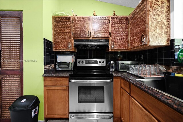 5610 NW 54th Ave, Tamarac, FL 33319 - kitchen with stainless steel electric stove, extractor fan, tasteful backsplash, and dark countertops