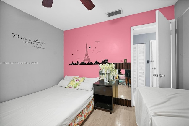 5610 NW 54th Ave, Tamarac, FL 33319 - bedroom featuring wood finished floors and a ceiling fan