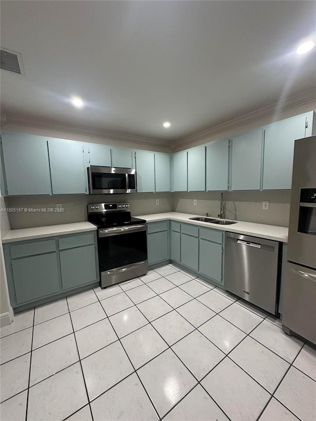 9510 SW 151st Ct, Miami, FL 33196 - kitchen with appliances with stainless steel finishes, light countertops, crown molding, light tile patterned floors, and recessed lighting