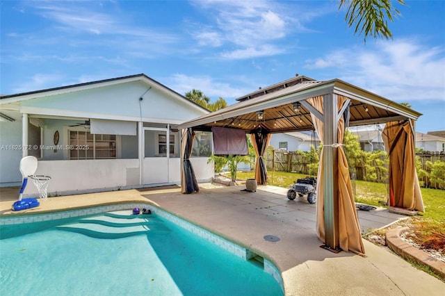 509 SW Hamburg Ter, Port St Lucie, FL 34984 - view of swimming pool with a gazebo, a patio, and a sunroom