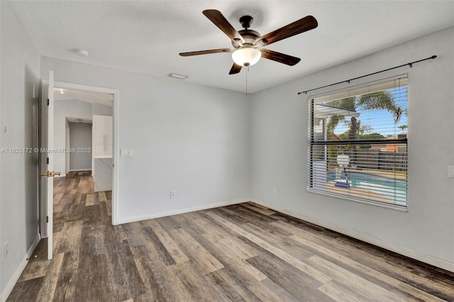 509 SW Hamburg Ter, Port St Lucie, FL 34984 - empty room featuring wood finished floors, ceiling fan, and a smoke detector