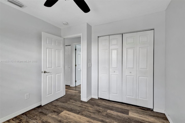 509 SW Hamburg Ter, Port St Lucie, FL 34984 - unfurnished bedroom featuring dark wood-style flooring, a closet, and ceiling fan