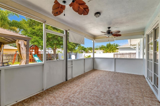 509 SW Hamburg Ter, Port St Lucie, FL 34984 - unfurnished sunroom featuring a ceiling fan and healthy amount of natural light