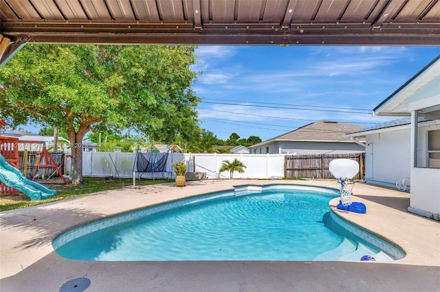 509 SW Hamburg Ter, Port St Lucie, FL 34984 - view of pool featuring a patio and a fenced backyard